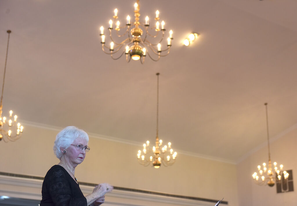 Eunice Morrow translates a worship song to American Sign Language